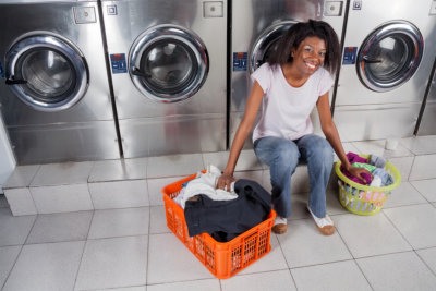 woman with laundry smiling